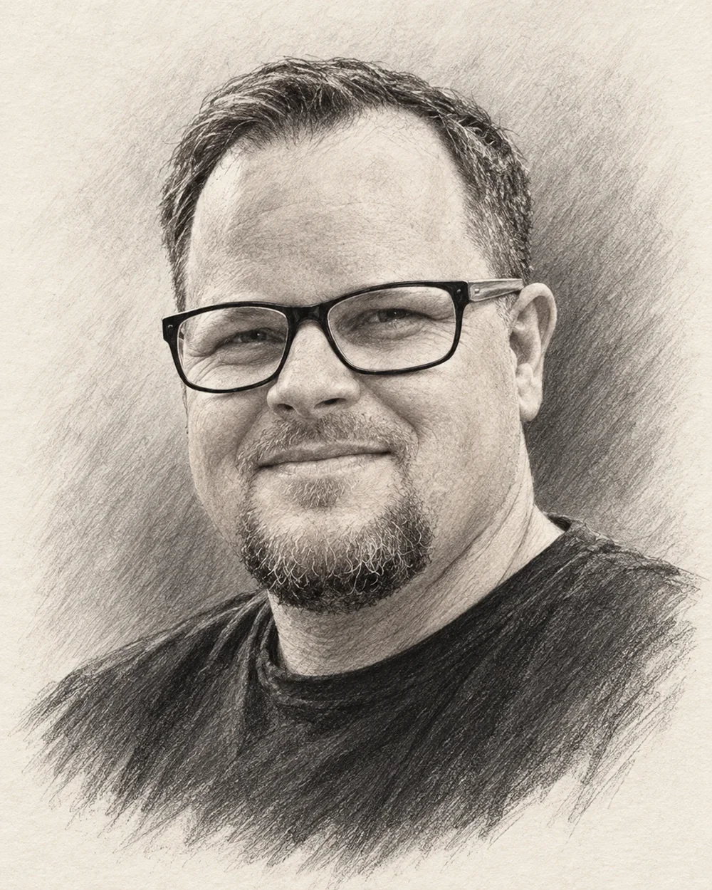 Portrait of Ben Frazier, wearing dark-rimmed glasses.